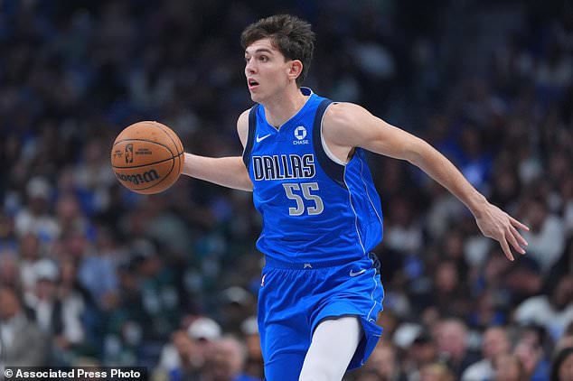 Dallas Mavericks forward Sergio de Larrea works the floor against the San Antonio Spurs during the first half of an NBA basketball game Saturday, Oct. 24, 2026, in Dallas. (AP Photo/Julio Cortez)