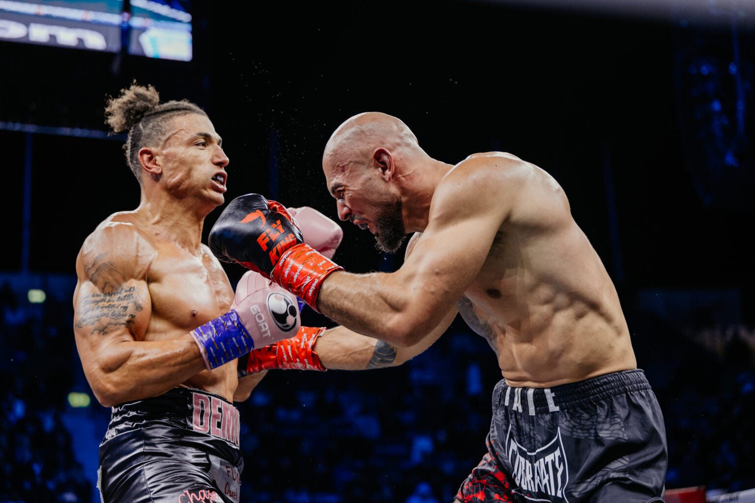 Chase DeMoor and Andrew Tate punch each other during their boxing match