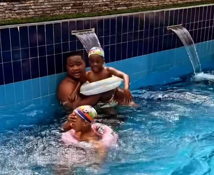 "Biggy And Sons" - Young Billionaire, Cubana Chief Priest Says As He Was Swimming With His Children 76a1b1f54e4f45f88e59b4c698a8799f?quality=uhq&format=webp&resize=720