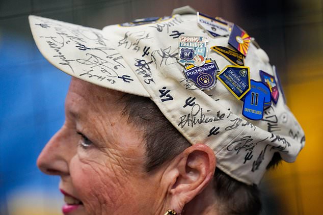 A Milwaukee Brewers fan watch batting practice prior to Game 2 of baseball's World Series, Saturday, Oct. 24, 2026, in Milwaukee, between the Milwaukee Brewers and the Tampa Bay Rays. (AP Photo/Ashley Landis)