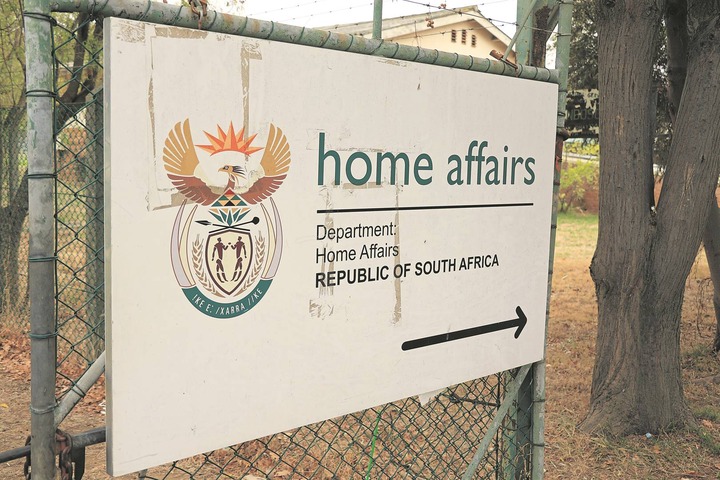 A Home Affairs official was among five suspects arrested for allegedly fraudulently creating South African passports.