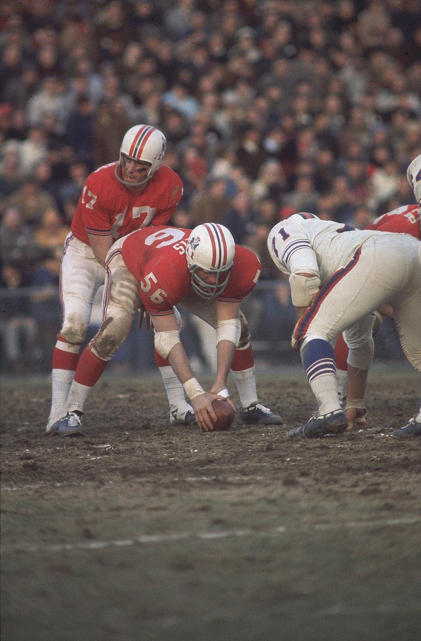 Boston Patriots Jon Morris and QB Mike Taliaferro on the field in a game.