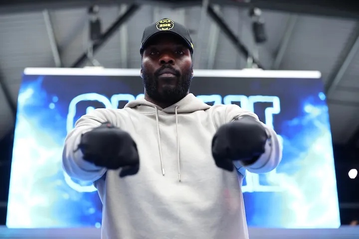 Lawrence Okolie poses with his hands held toward the camera at a media workout on July 16, 2025.