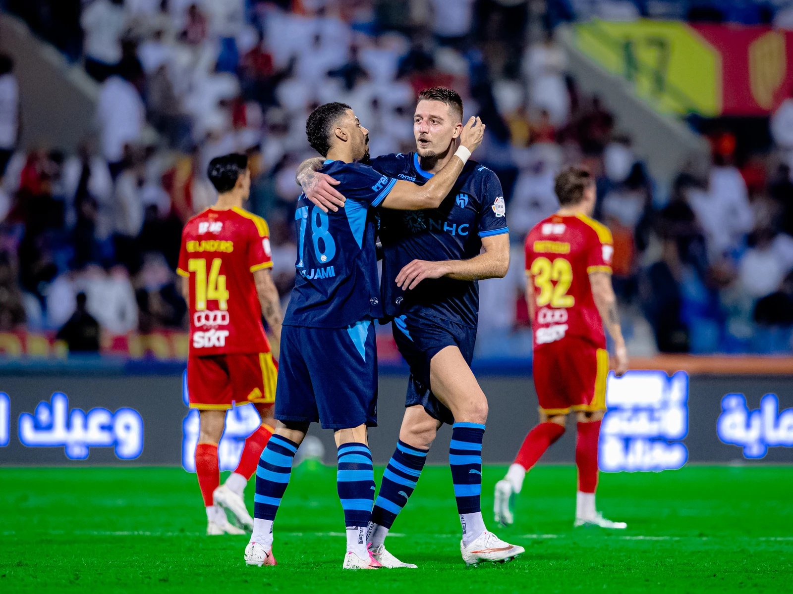 Sergej Milinkovic-Savic celebrates with Ali Lajami after scoring Al-Hilal's third. (SPL)