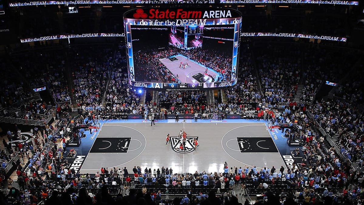 Angel Reese and Kiah Stokes compete for the opening tip-off during WNBA Finals Game 6.