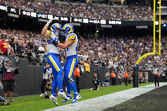 Los Angeles Rams tight end Davis Allen, left, celebrates his touchdown with tight end Colby Parkinson during the first half of an NFL football game against the Las Vegas Raiders, Sunday, Oct. 25, 2026, in Las Vegas. (AP Photo/John Locher)