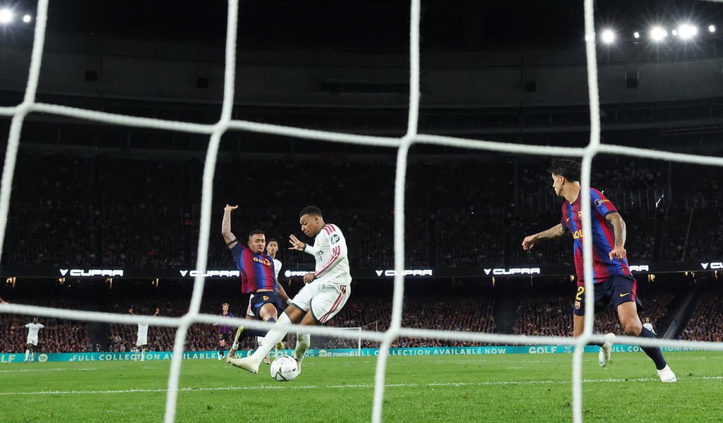 Kylian Mbappe scores Real Madrid’s second goal in their 2-1 win on Sunday. Photo: Reuters