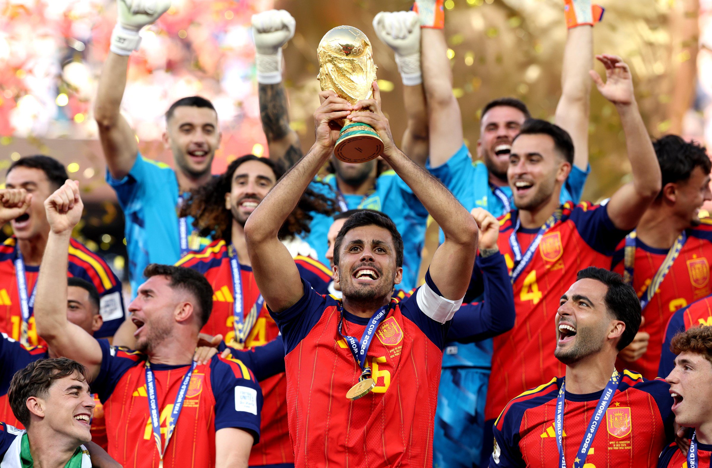 EAST RUTHERFORD, NEW JERSEY - JULY 19: Rodri #16 of Spain lifts the FIFA World Cup Winner’s Trophy after the team’s victory following the FIFA World Cup 2026 Final match between Spain and Argentina at New York New Jersey Stadium on July 19, 2026 in East Rutherford, New Jersey. (Photo by Alex Pantling - FIFA/FIFA via Getty Images)