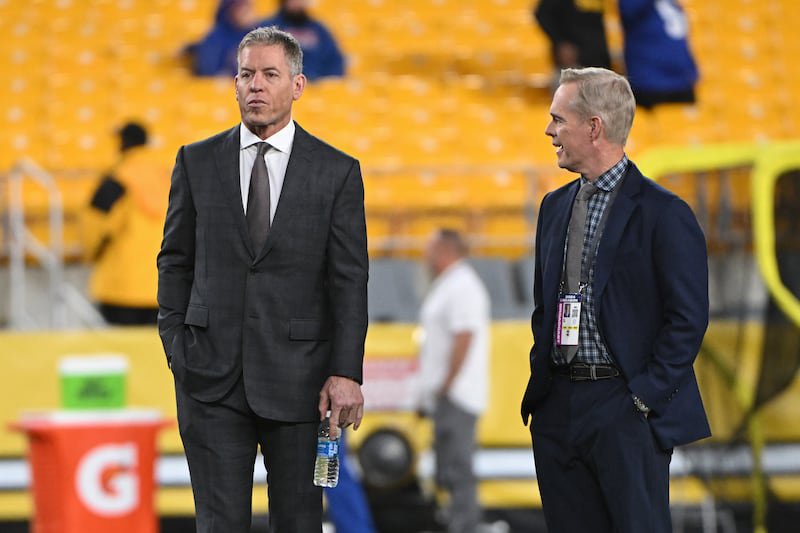 Oct 28, 2024; Pittsburgh, Pennsylvania, USA; Hall of Fame quterback Troy Aikman stands with his Monday Night Football Broadcast announcer Joe Buck before a game between the Pittsburgh Steelers and New York Giants at Acrisure Stadium. Mandatory Credit: Barry Reeger-Imagn Images