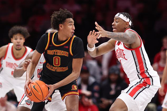 FILE - Southern California guard Alijah Arenas, left, works in front of Ohio State forward Amare Bynum during an NCAA college basketball game in Columbus, Ohio, Feb. 11, 2026. (AP Photo/Paul Vernon, File)