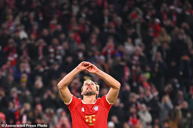 Munich's Harry Kane reacts after missing a penalty kick during the German Bundesliga soccer match between FC Bayern Munich and Borussia Dortmund in Munich, Germany, Saturday, Oct. 31, 2026. (Tom Weller//dpa via AP)