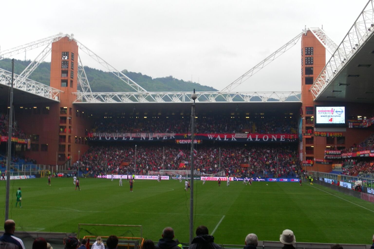 Football match at Genoa's Stadio Luigi Ferraris, with its red corner towers and packed stands