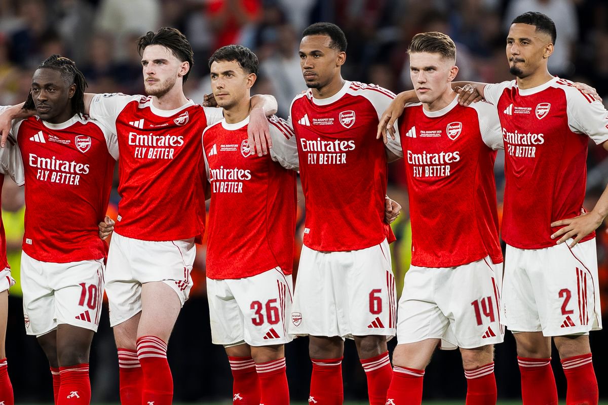 Players of Arsenal FC (L-R: Jurrien Timber, Noni Madueke, Gabriel Martinelli, Eberechi Eze, Declan Rice, Martin Zubimendi, Gabriel Magalhaes, Viktor Gyokeres, William Saliba) react during the penalty shootout of the UEFA Champions League 2025/26 final football match between Paris Saint-Germain FC and Arsenal FC. 