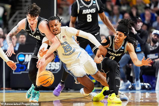 FILE - North Carolina forward Jarin Stevenson vies for the ball with VCU forward Lazar Djokovic, left, and guard Brandon Jennings during the second half in the first round of the NCAA college basketball tournament, March 19, 2026, in Greenville, S.C. (AP Photo/Chris Carlson, File)