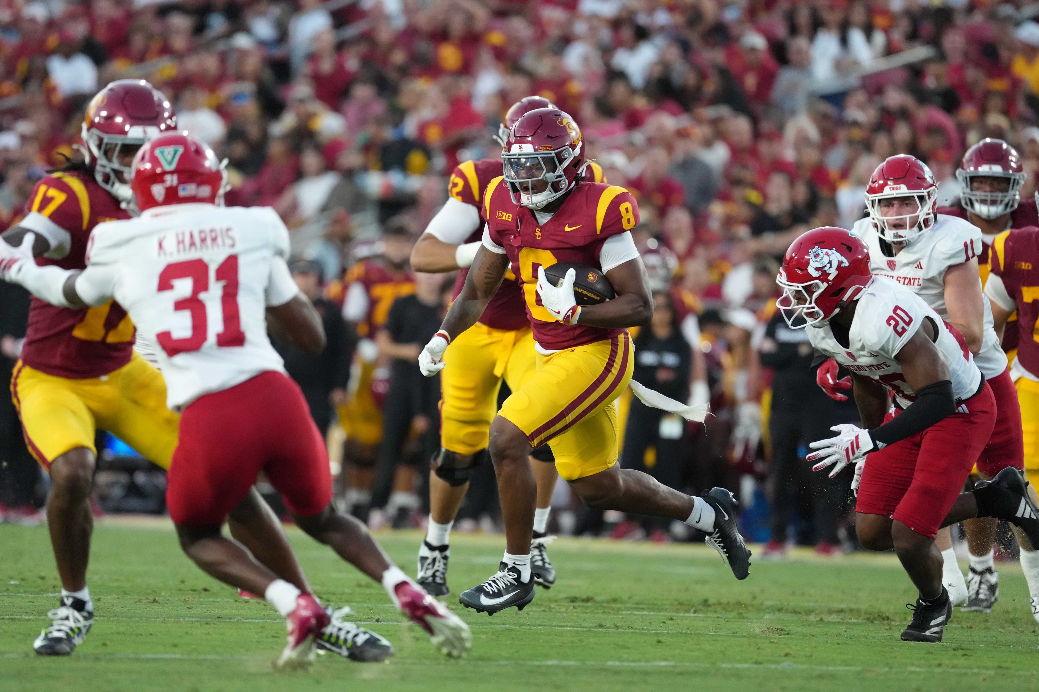 Sep 4, 2026; Los Angeles, California, USA; Southern California Trojans running back King Miller (8) carries the ball against the Fresno State Bulldogs in the first half at United Airlines Field at Los Angeles Memorial Coliseum. Mandatory Credit: Kirby Lee-Imagn Images