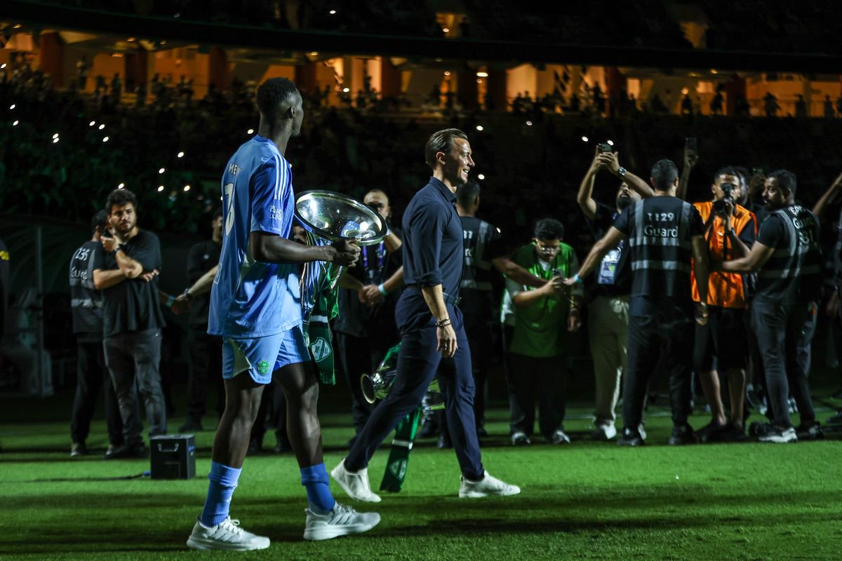 Matthias Jaissle and Edouard Mendy of Al Ahly hold two Asian Champions League Cups during an Al Ahly ceremony