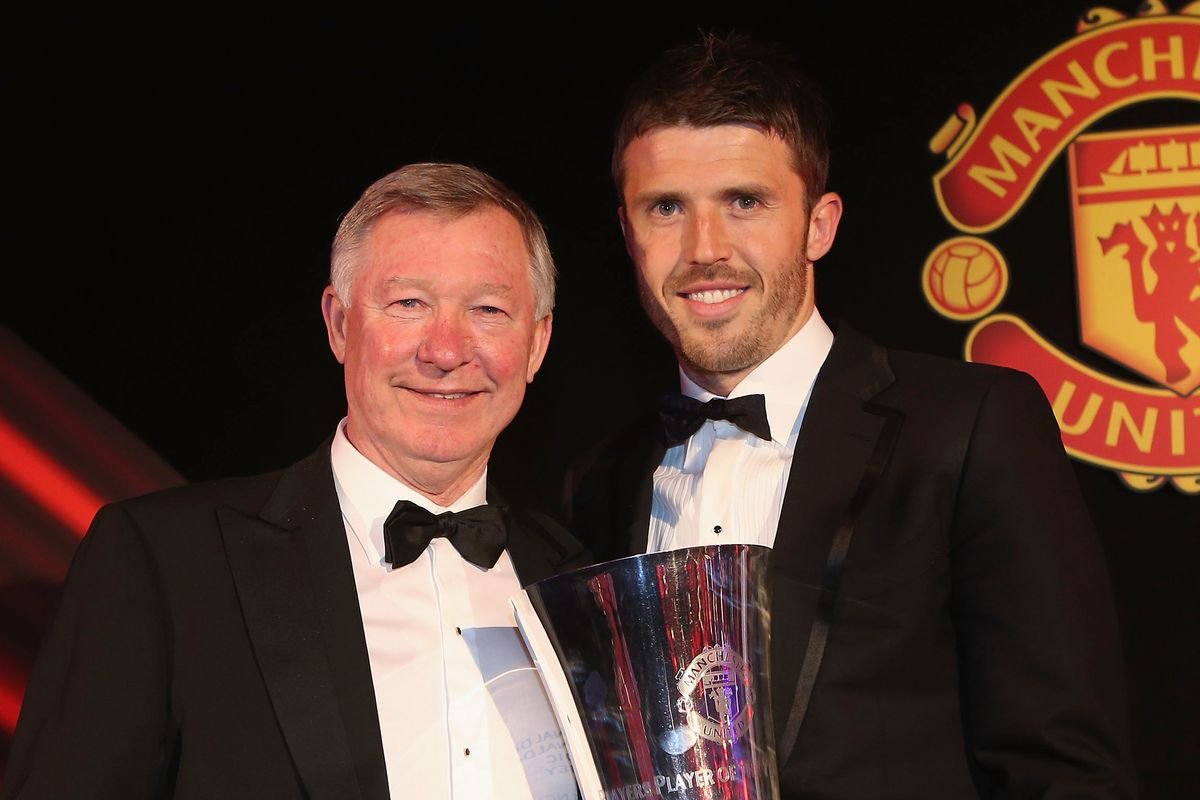 Michael Carrick is chatting to Sir Alex Ferguson during his difficult spell as Man Utd boss