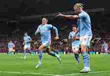 Phil Foden of Manchester City celebrates alongside teammate Erling Haaland after scoring the team's third goal during the Premier League match betw...