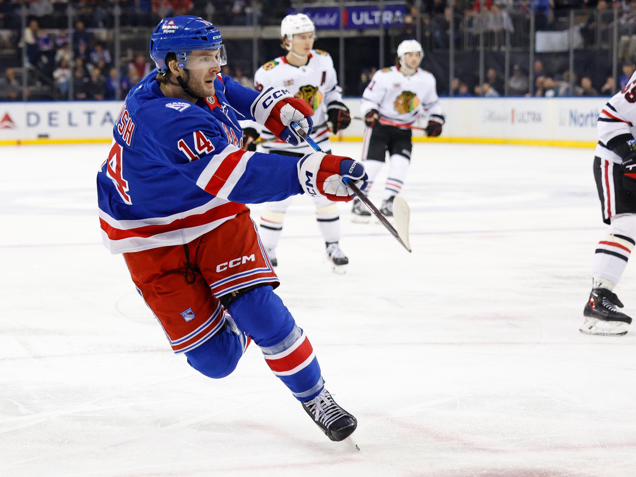 New York Rangers right wing Taylor Raddysh takes a shot against the Chicago Blackhawks.