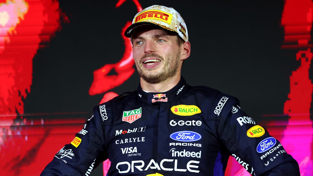 Max Verstappen poses on the podium at the Singapore Grand Prix