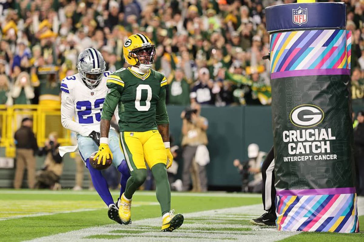 Matthew Golden #0 of the Green Bay Packers scores a touchdown against Ameer Speed #23 of the Dallas Cowboys during the first quarter at Lambeau Field on October 18, 2026 in Green Bay, Wisconsin.