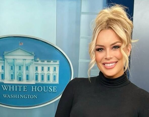 Britt McHenry poses in front of a White House sign