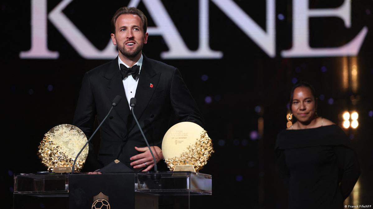 England and Bayern Munich forward Harry Kane speaks on stage after receiving the Gerd Muller Trophy for the Best Striker during the 2026 Ballon d'Or France Football award ceremony at the Palladium Theatre in London on October 26, 2026