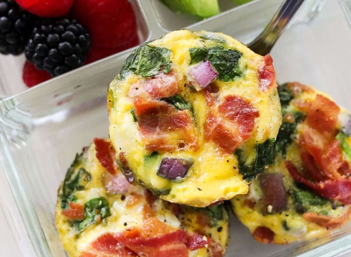 Slide 10 of 14: For the meal prep connoisseurs, these bacon and spinach egg muffins work well for busy mornings on the go. Simply add cooked bacon, spinach, and red onion into a muffin tin, then pour over the egg mixture and bake! Easy, peasy.Get the recipe at Cook At The Home Mom.