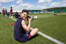 Declan Rice of England takes photos during a training session at Spa & Golf Resort Weimarer Land on June 18, 2024 in Blankenhain, Germany.