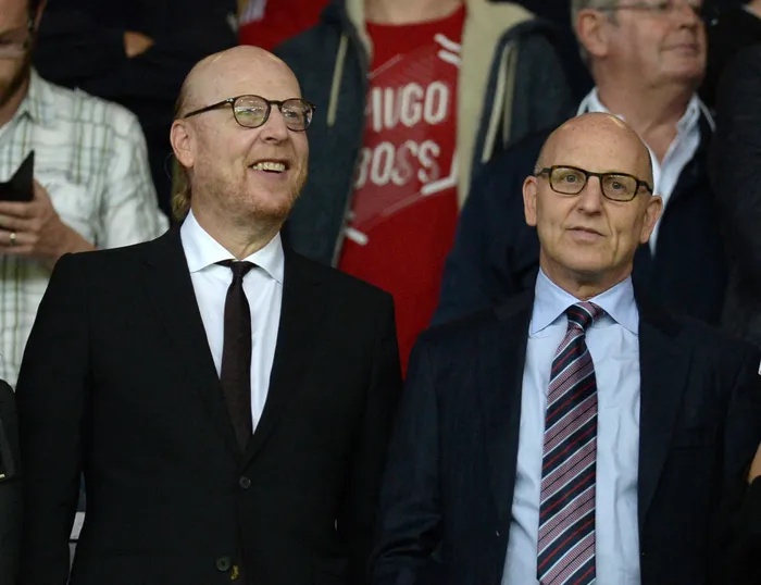 HAVE A LOT TO ANSWER FOR: Manchester United’s co-chairmen Avram, left, and Joel Glazer