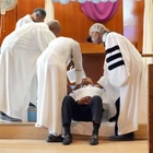 New York City's mayor gets baptized in jail by Rev. Al Sharpton on Good Friday