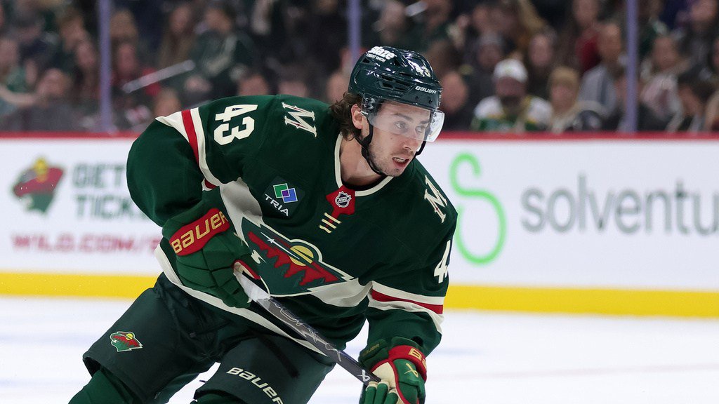 Minnesota Wild defenseman Quinn Hughes skates with the puck during the first period of an NHL hockey game against the Boston Bruins, Saturday, Oct. 3, 2026, in St. Paul, Minn. (AP Photo/Bailey Hillesheim)