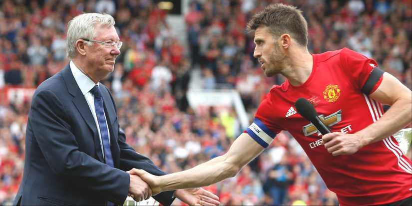 Sir Alex Ferguson shaking hands with Michael Carrick