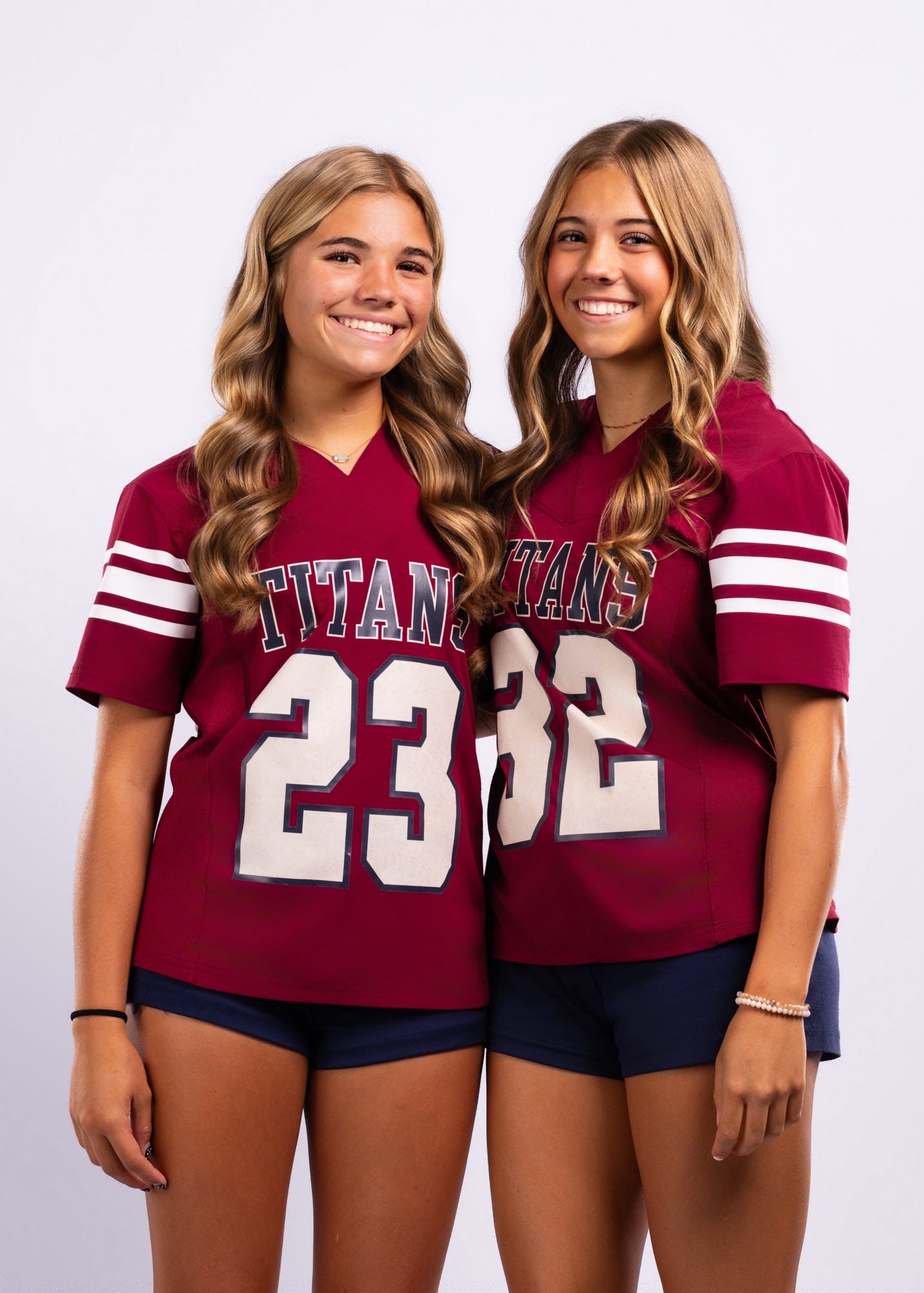 The Classical Academy sisters Kennedy and Reagan pose for headshots for their flag football team. 