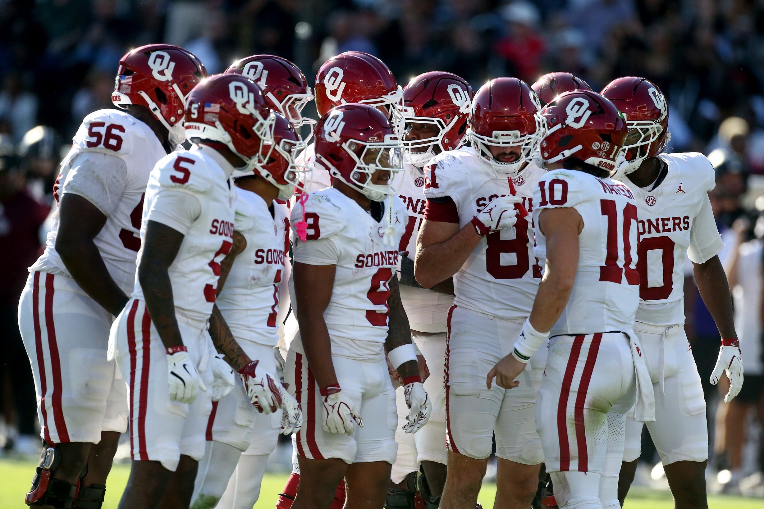 Oct 24, 2026; Starkville, Mississippi, USA;  Oklahoma Sooners quarterback John Mateer (10) huddles with his team during the second quarter against the Mississippi State Bulldogs at Davis Wade Stadium at Scott Field.  Mandatory Credit: Petre Thomas-Imagn Images