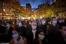 Crowds gathered at Place de la Sorbonne to watch the National Tribute to the murdered school teacher Samuel Paty led by French president Emmanuel Macron on October 21, 2020 in Paris