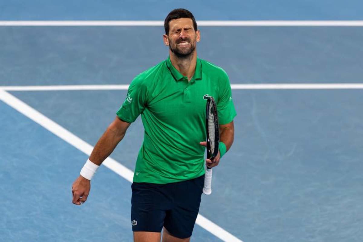 Feb 01, 2026; Melbourne, Victoria, Australia; Novak Djokovic of Serbia in action against Carlos Alcaraz of Spain in the final of the men’s singles at the Australian Open at Rod Laver Arena in Melbourne Park. © Mike Frey-Imagn Images