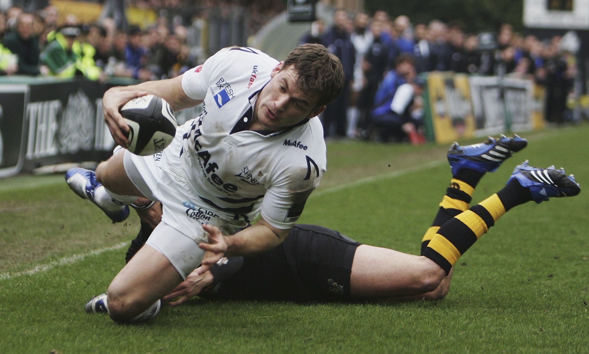 Sale Sharks' Mark Cueto touches down during a 2007 match against Wasps.