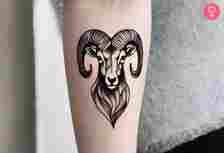 Black and white bighorn sheep head tattoo on the forearm of a woman