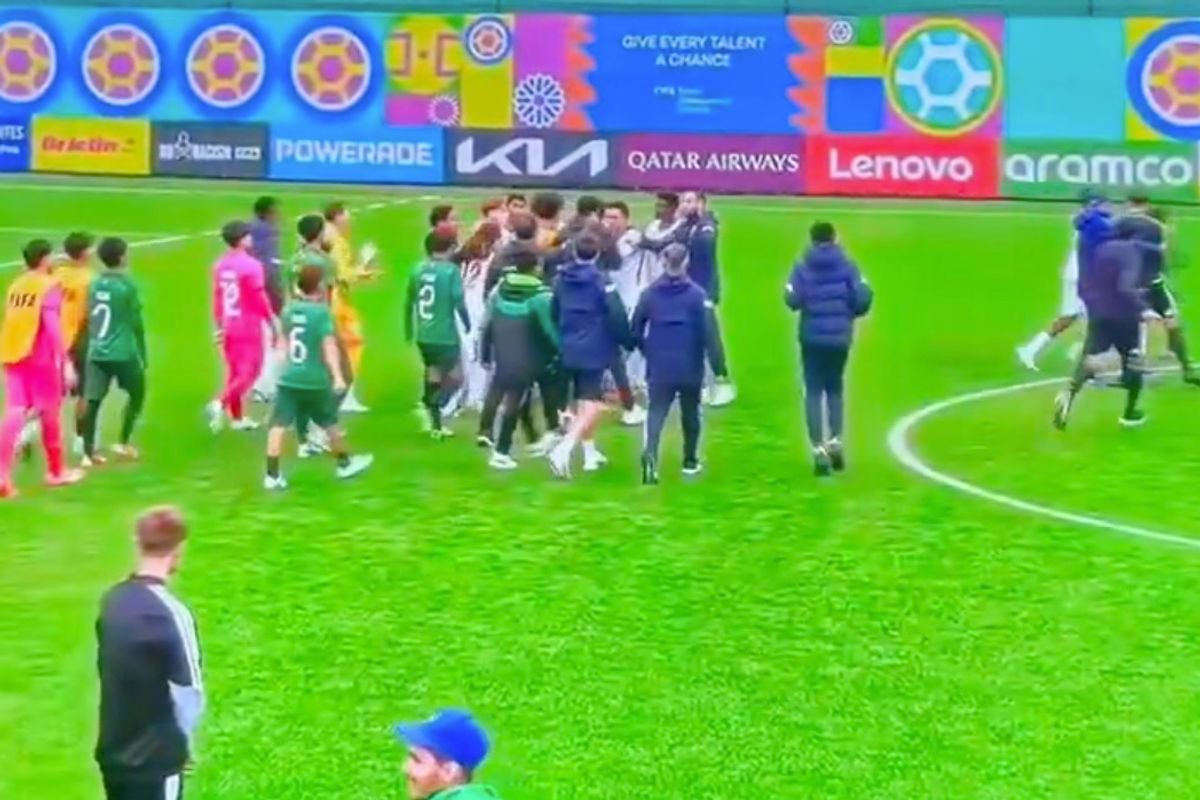 England players rush to protect referee
