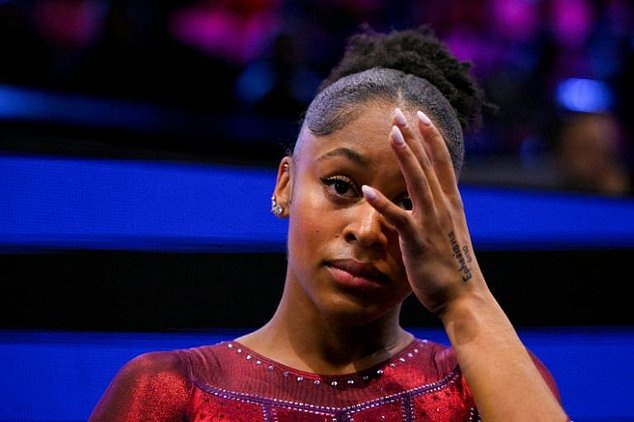 Skye Blakely reacts after completing the error-free floor excercise she needed to ensure gold