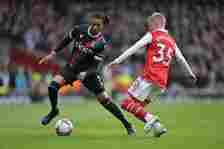 Michael Olise of Crystal Palace and Oleksandr Zinchenko of Arsenal FC in action during the Premier League match between Arsenal FC and Crystal Pala...