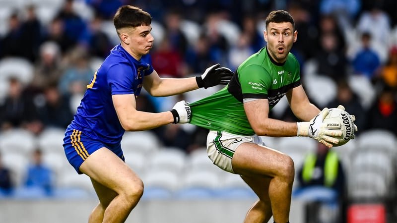 26 October 2025; Nemo Rangers goalkeeper Michael Aodh Martin is tackled by Rickey Barrett of St Finbarr's during the Cork County Senior Club Football Championship final match between Nemo Rangers and St Finbarr's at SuperValu Pairc Ui Chaoimh in Cork. Pho