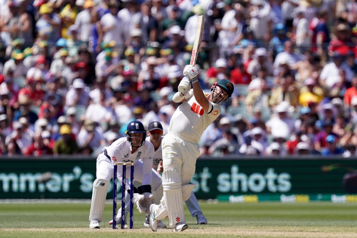 Australia's Travis Head (right) bats while England???s Jamie Smith (left) watches from behind the stumps on day three of the third NRMA Insurance Ashes Series 2025 test at the Adelaide Oval, Australia. Picture date: Friday December 19, 2025. PA Photo. Photo credit should read: Robbie Stephenson/PA Wire. RESTRICTIONS: Use subject to restrictions. Editorial use only, no commercial use without prior consent from rights holder.