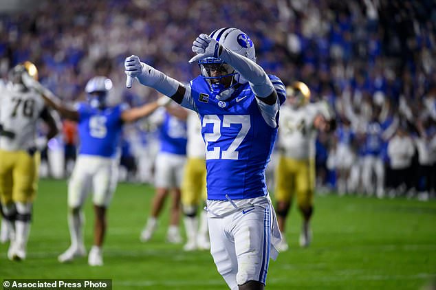 BYU defensive back Matthias Leach (27) reacts to making the defensive stop to end the game during the second half of an NCAA college football game against Notre Dame, Saturday, Oct. 17, 2026, in Provo, Utah. (AP Photo/Tyler Tate)