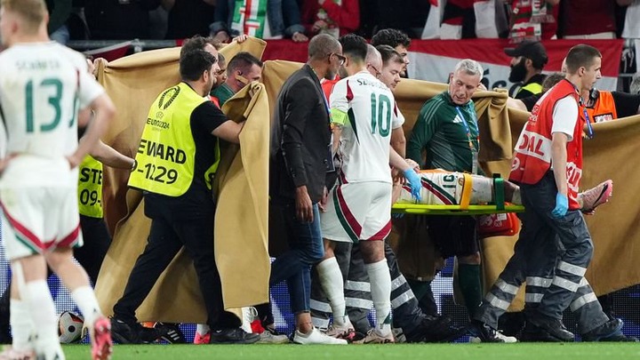 Hungary's Dominik Szoboszlai with Barnabas Varga as he leaves the pitch on a stretcher following a collision with Scotland goalkeeper Angus Gunn during the UEFA Euro 2024 Group A match at the Stuttgart Arena in Stuttgart, Germany. Picture date: Sunday June 23, 2024.

