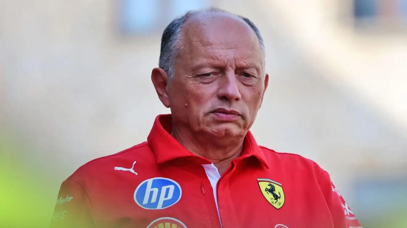 Ferrari team principal Fred Vasseur looks on.