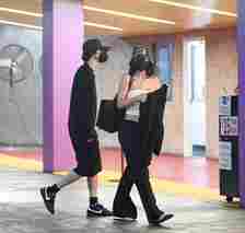 Kylie Jenner and Timothée Chalamet walking in a parking lot together