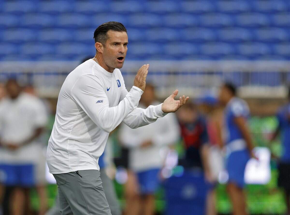 Duke head coach Manny Diaz encourages his team during warmups prior to the Blue Devils’ season opener against Tulane on Sept. 5, 2026, at Wallace Wade Stadium in Durham, N.C.