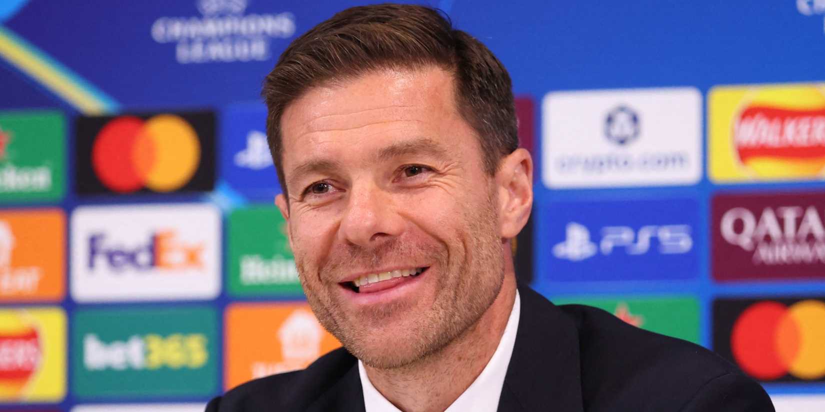 Xabi Alonso smiles in a press conference while working as Real Madrid manager